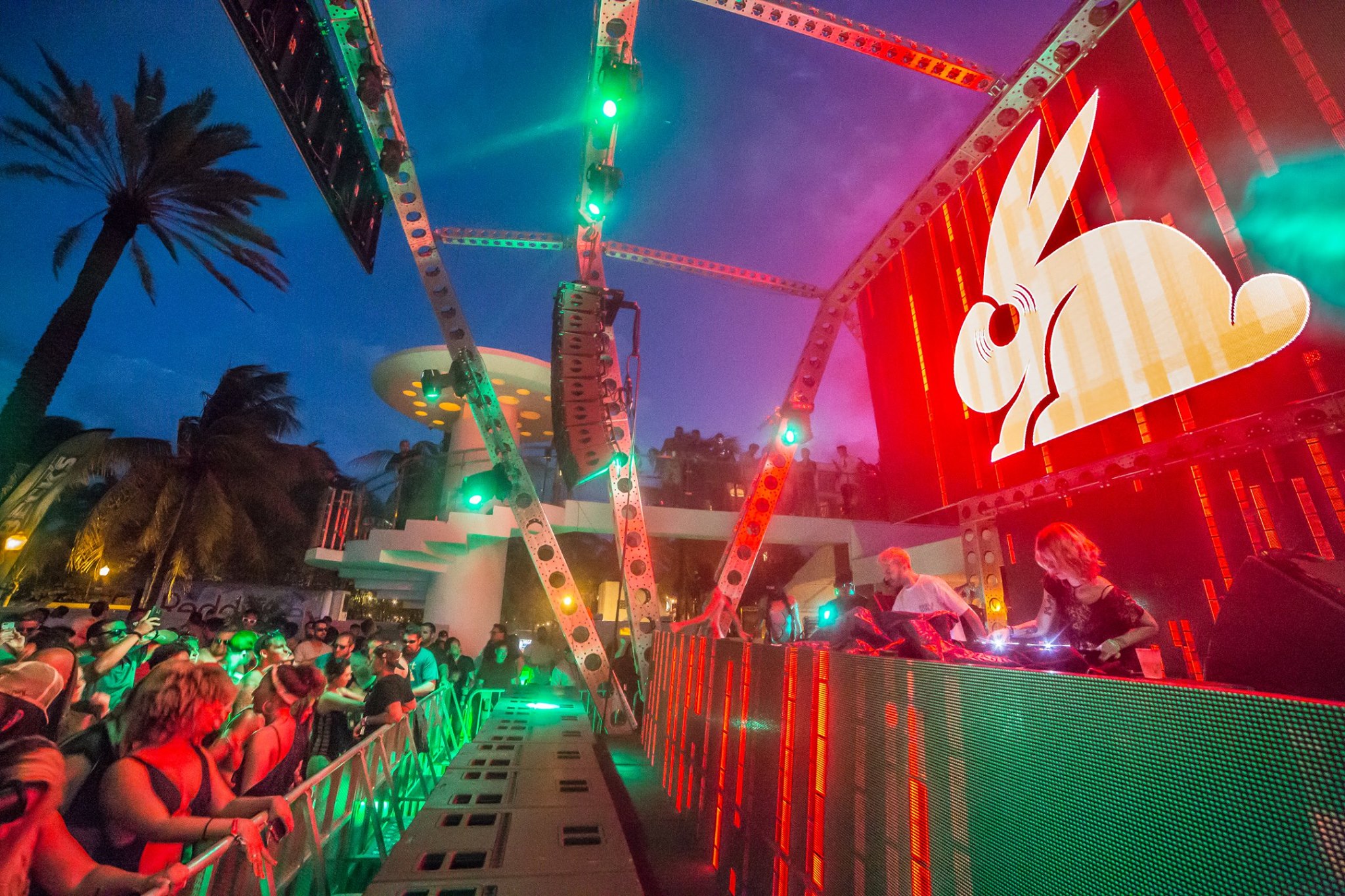 Wide view of the pool party crowd and main stage