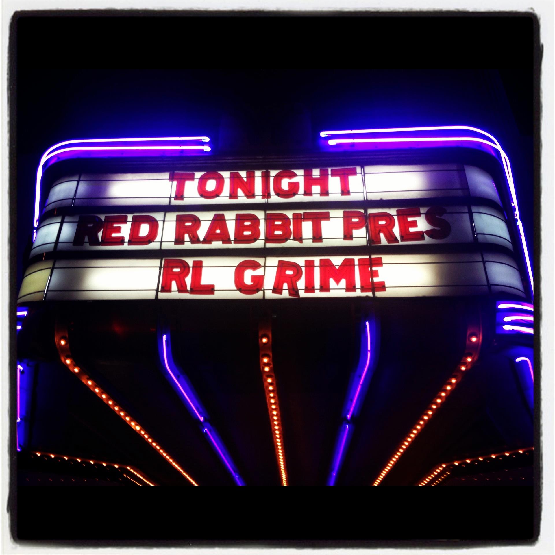 Neon theater marquee reading Tonight Red Rabbit Presents RL Grime